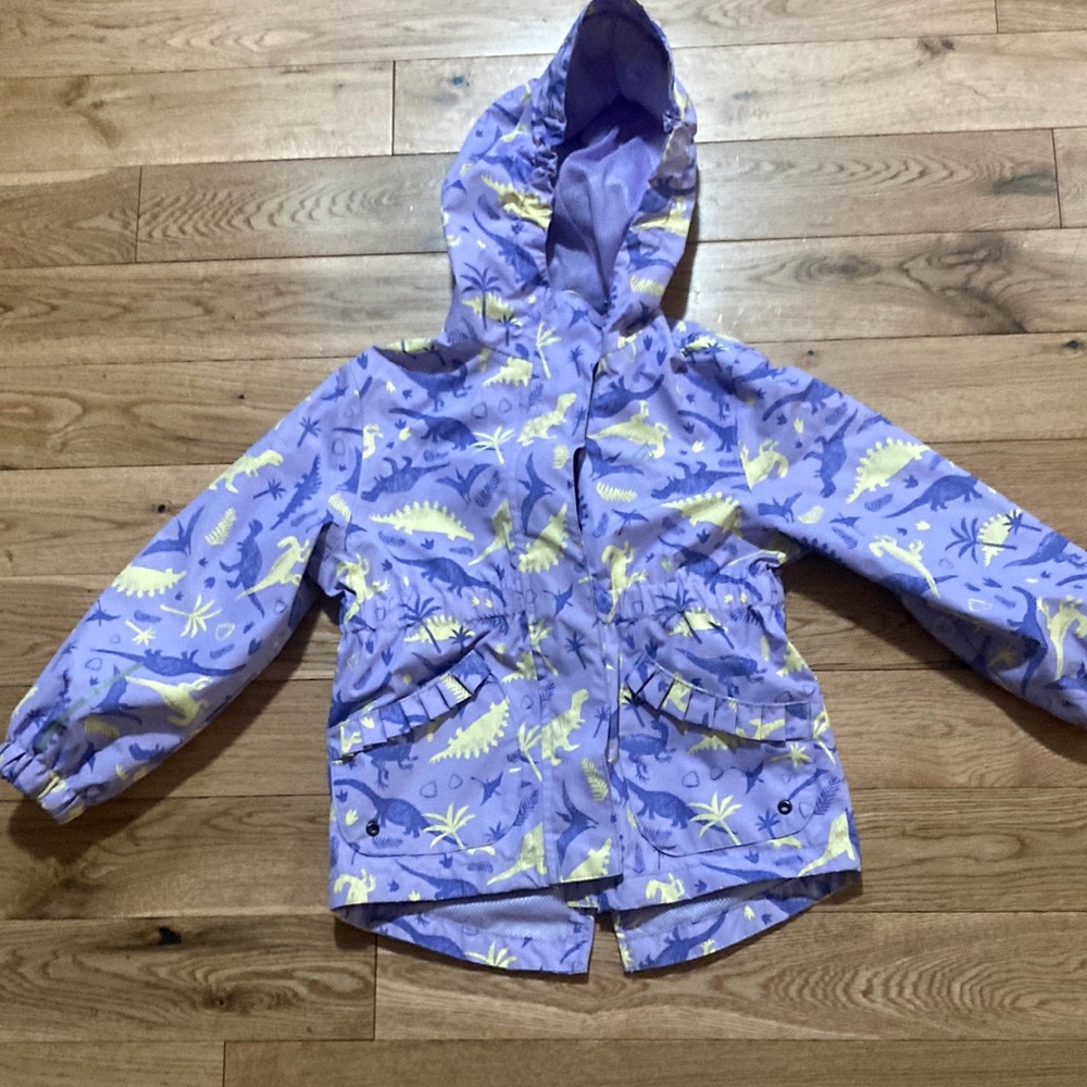 Ripzone light purple with purple and yellow dinosaurs on it rain jacket